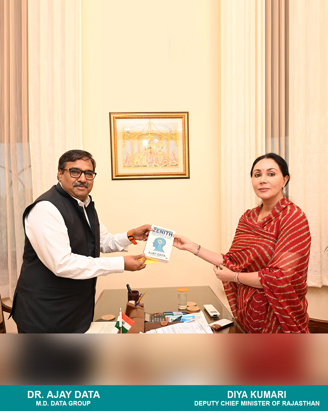 Dr. Ajay Data handing over the book titled 'Zenith' to the Deputy Chief Minister, Diya Kumari